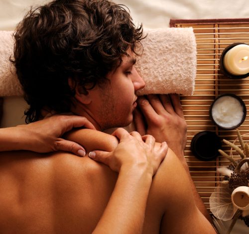 The young Man on spa treatment - recreation,  rest,  relaxation and massage. Hygh angle view